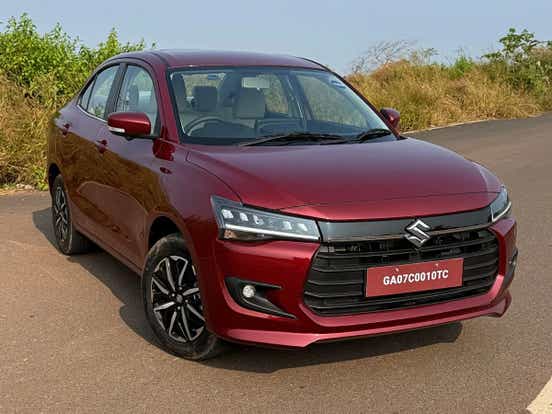 new 2024 maruti suzuki dzire front three quarters view red