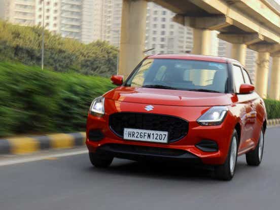 2024 maruti suzuki swift red driving aryan
