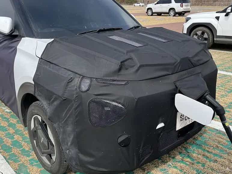 Kia Carens EV front charging port spotted