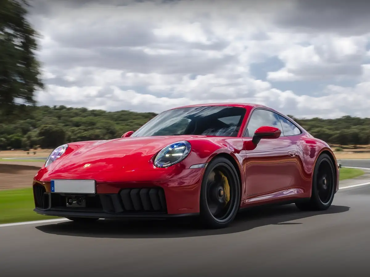 Porsche 911 Carrera 4 GTS sports car, 0-100 kmph in 3.0 seconds, 312 kmph top speed, ₹3.20 crore price in India — high-performance AWD 911 model.