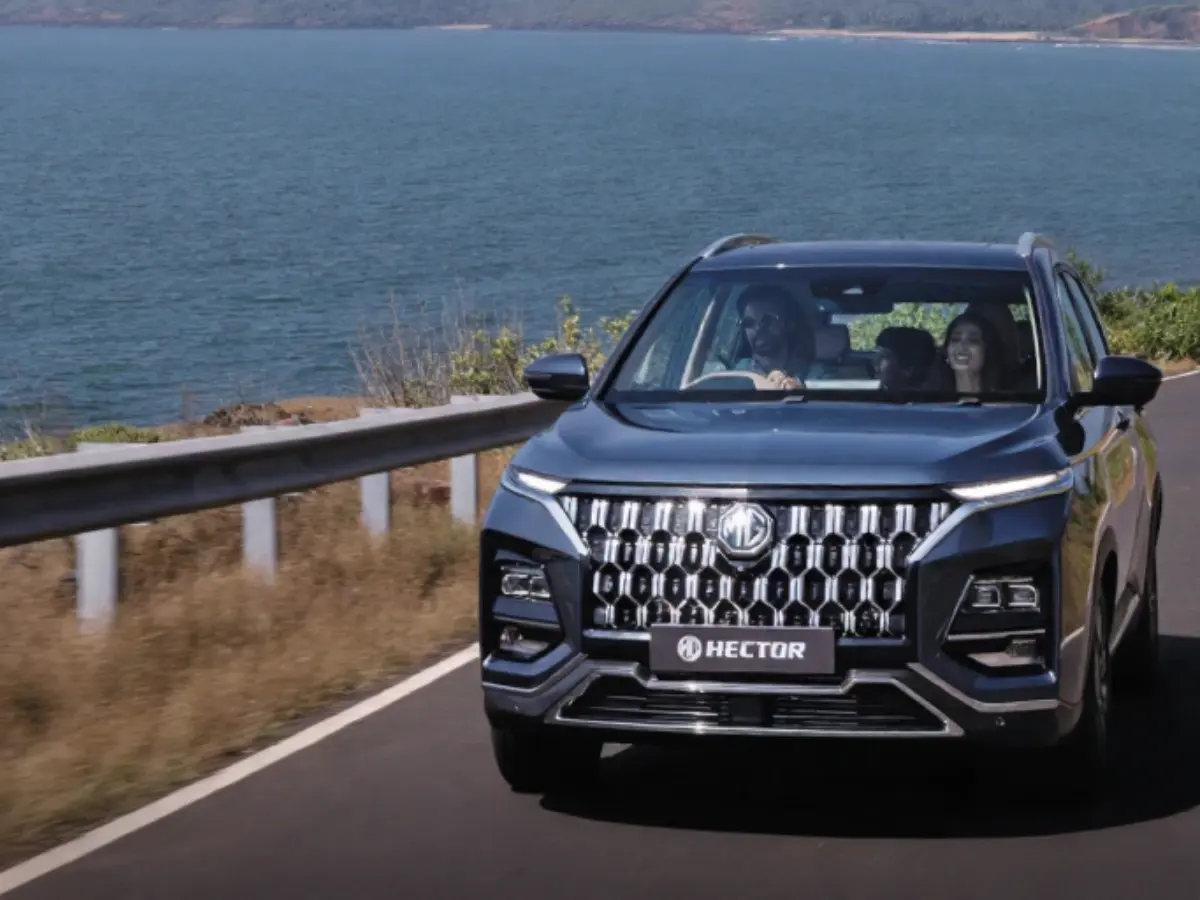 MG Hector FaceliftMG Hector Caledon Blue shade driving on a coastal road.