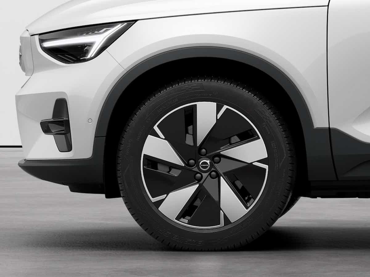 Front wheel and headlight view of a Volvo EC40