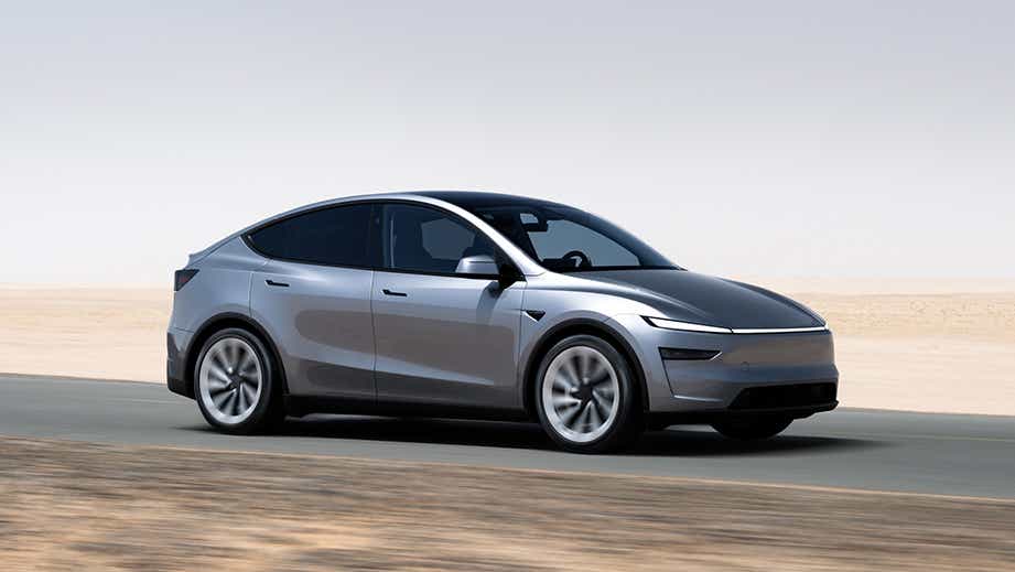 side view of a Tesla Model Y on a desert road