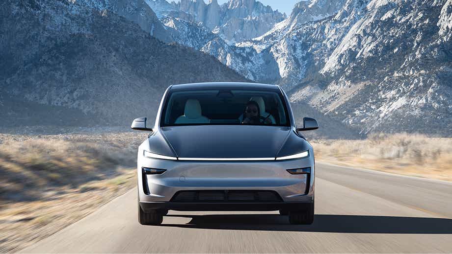 front view of a Tesla Model Y on a scenic mountain road