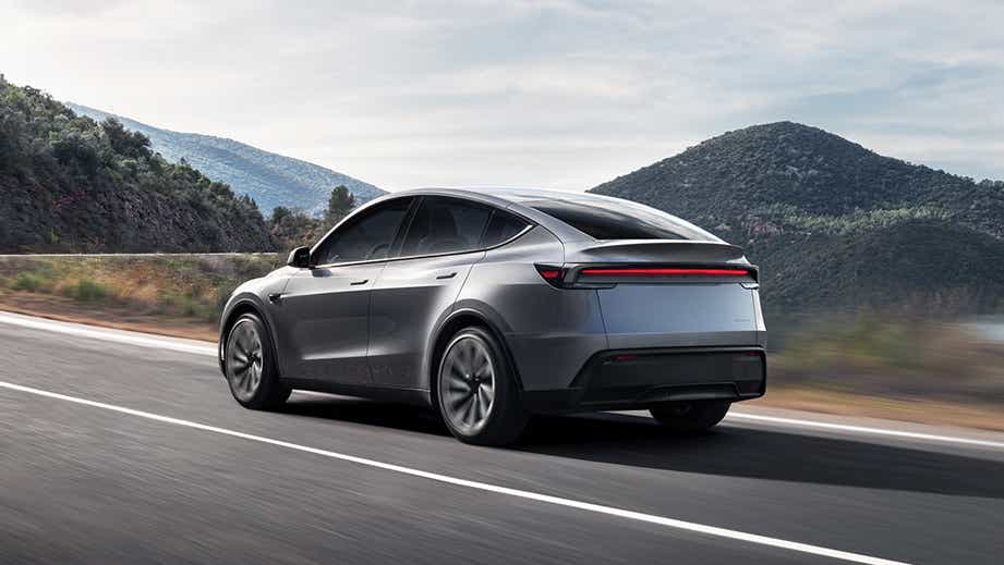 Rear three-quarter view of a Stealth Grey Tesla Model Y