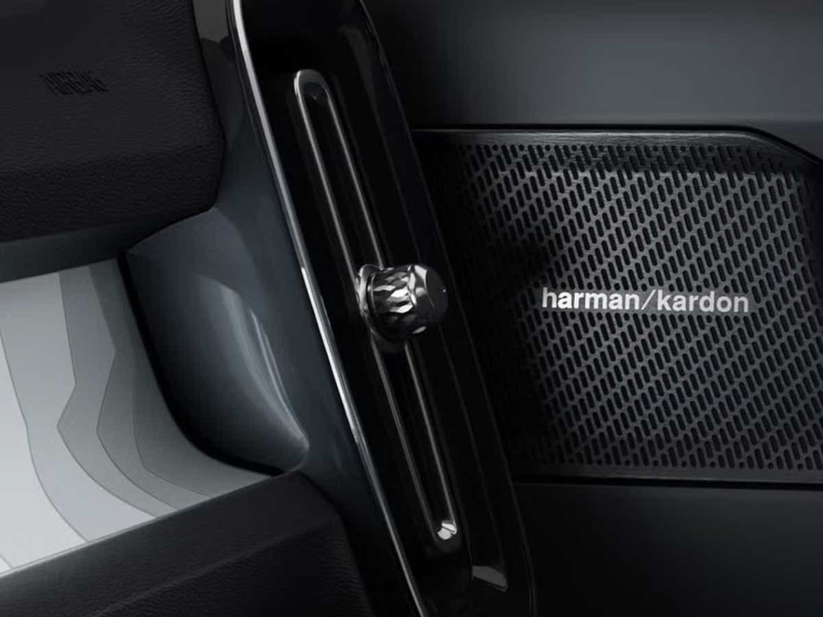 Close-up of a Volvo EX40 interior dashboard air vent and speaker grille