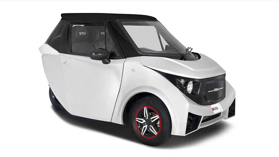 front three-quarter view of a White With Black Roof Strom Motors R3