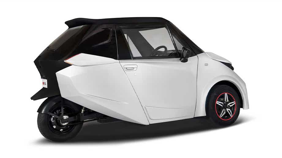 side view of a White With Black Roof Strom Motors R3