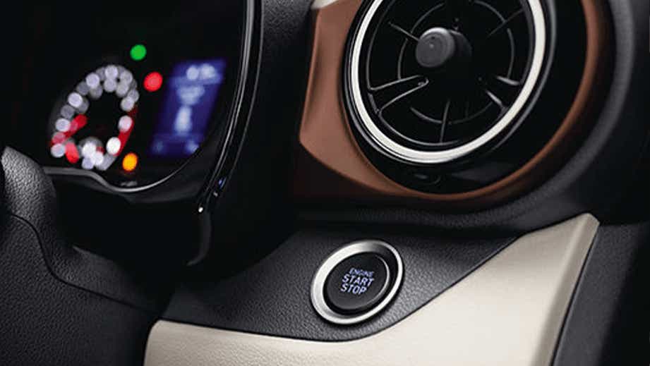 Dashboard and push button start of a Hyundai Aura