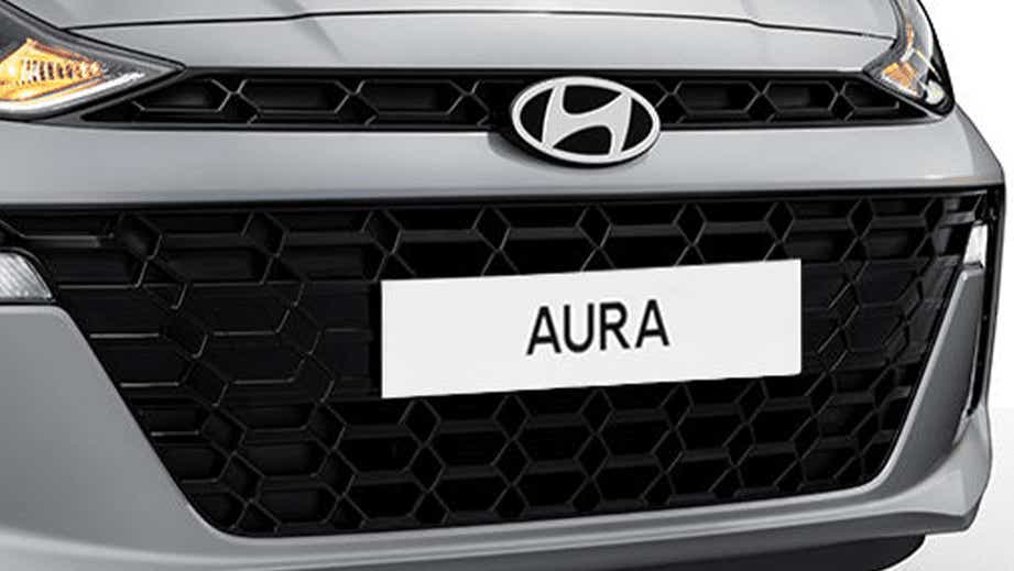 Front grille and headlight view of a Hyundai Aura