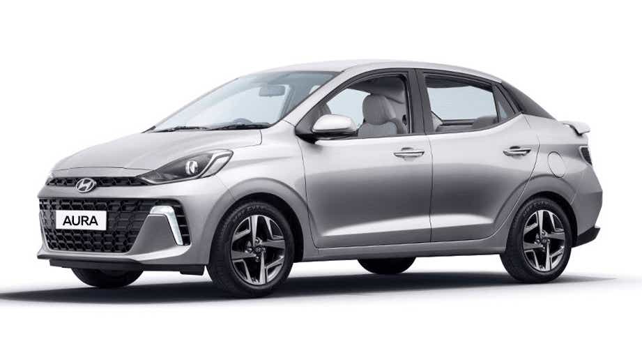 front three-quarter view of a Typhoon Silver Hyundai Aura