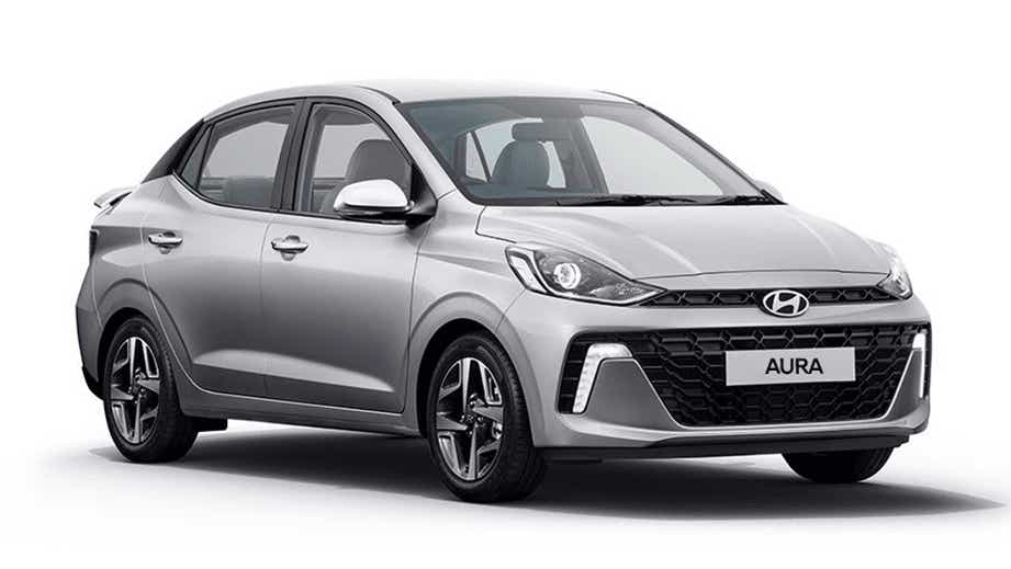 front three-quarter view of a Typhoon Silver Hyundai Aura