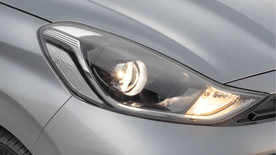 Headlight close-up of a Hyundai Aura