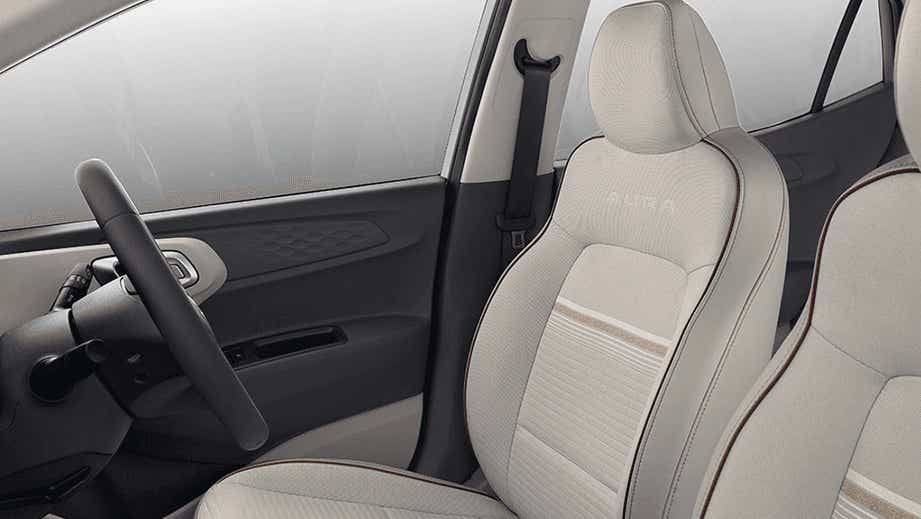 Front interior seat and dashboard view of a Hyundai Aura