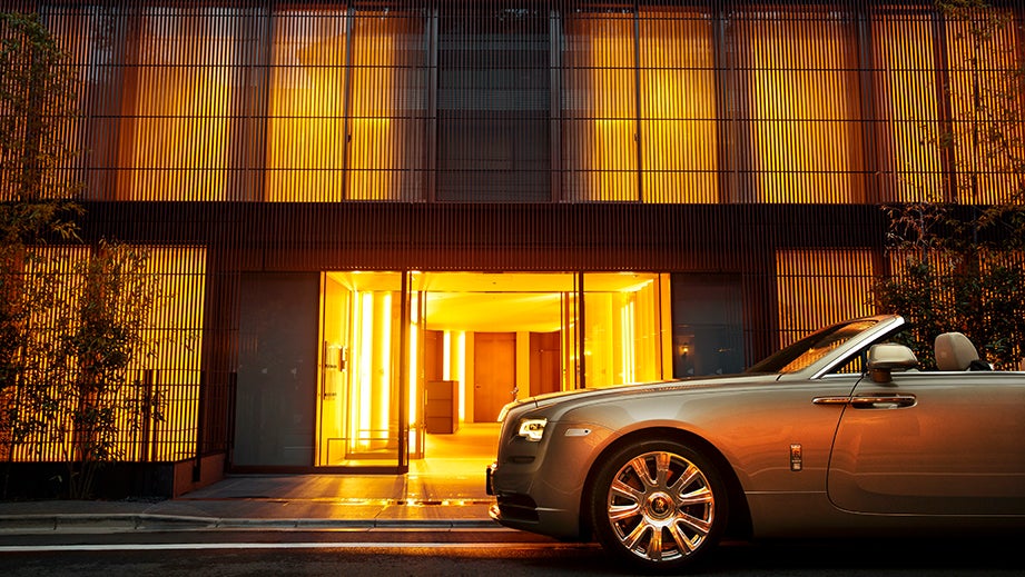 side view of a Sunny Yellow Rolls-Royce Dawn convertible