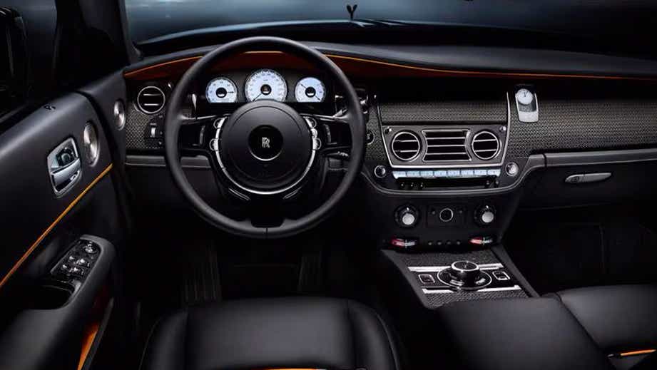 Interior dashboard view of a Sunny Yellow Rolls-Royce Dawn
