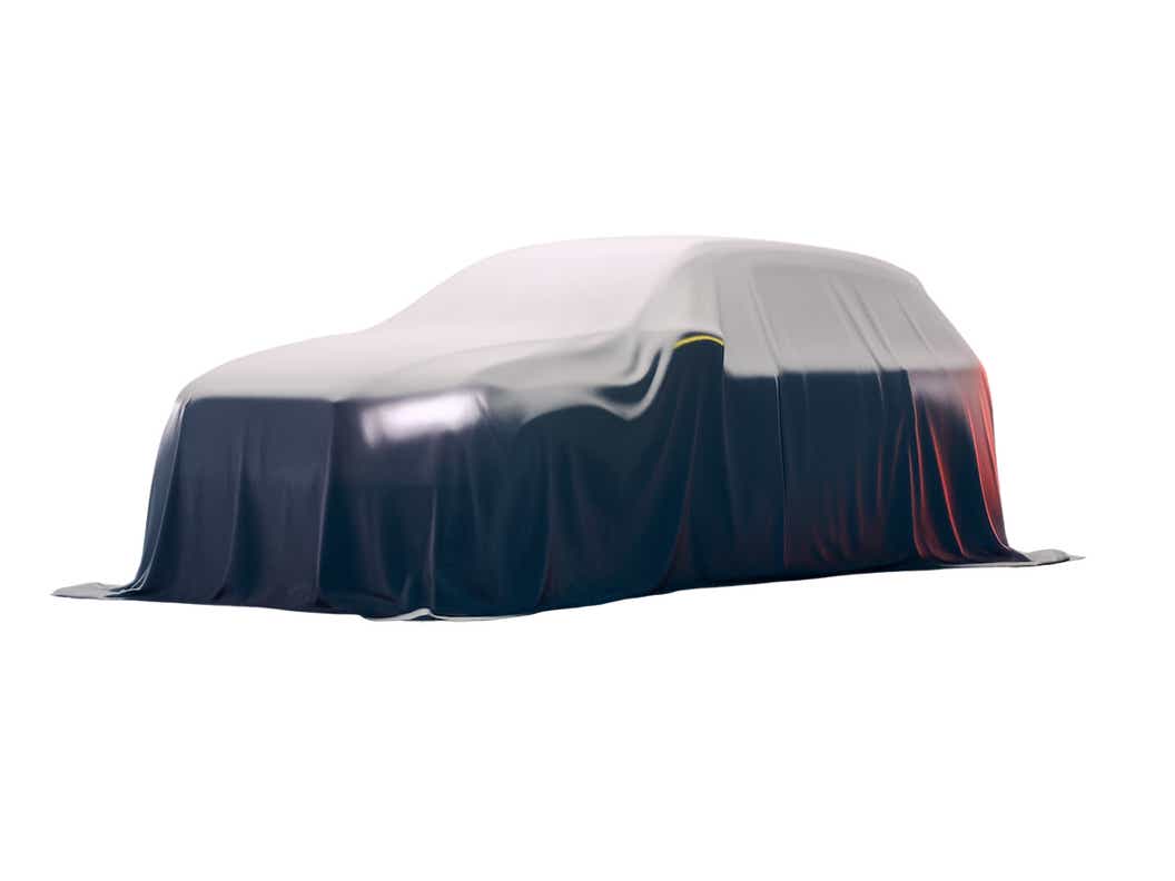 Covered full-car view of a Maruti Suzuki Brezza 2025