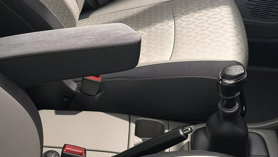 Front seat and armrest area of a Renault Triber