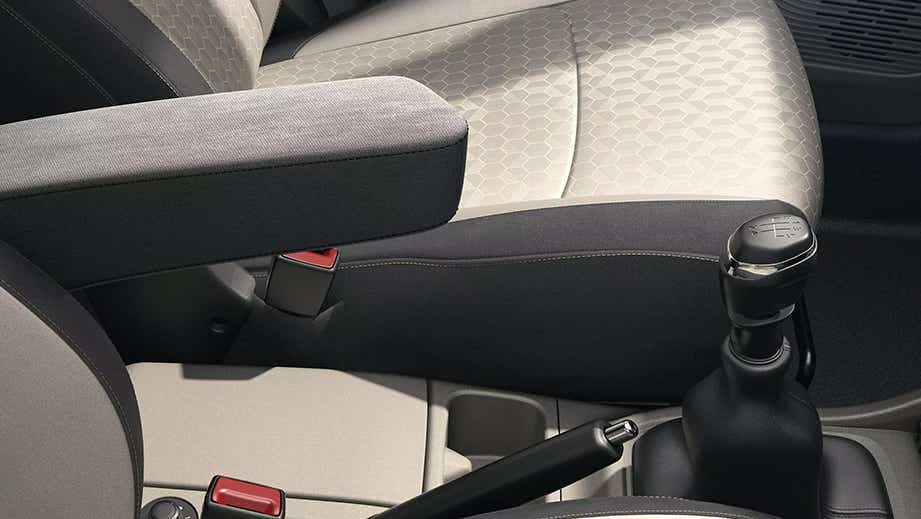 Front seat and armrest area of a Renault Triber