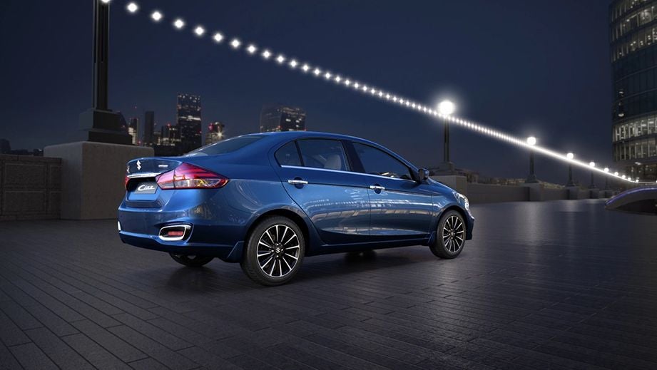 rear three-quarter of a Nexa Blue Maruti Suzuki Ciaz