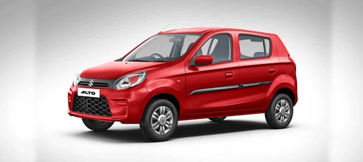 front three-quarter view of a Uptown Red Maruti Suzuki Alto