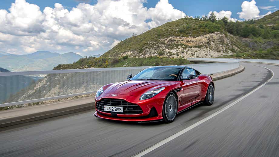 front three-quarter view of an Hyper Red Aston Martin DB12