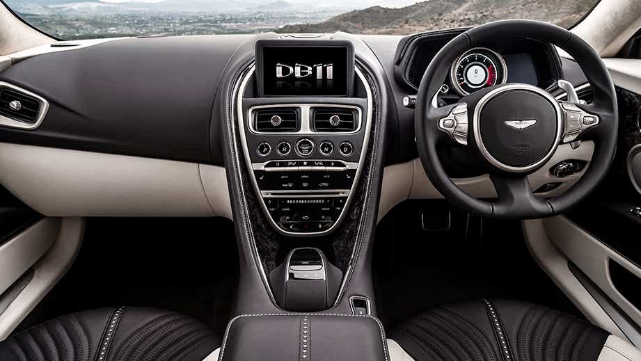 Interior dashboard of a Tiffany Green Aston Martin DB11