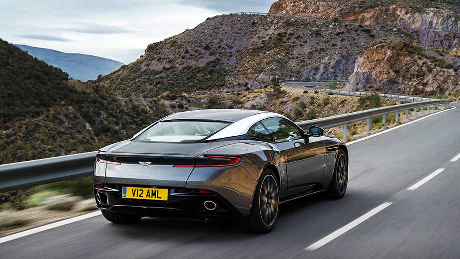 Rear three-quarter view of a Tiffany Green Aston Martin DB11