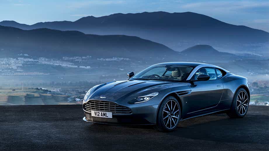 front three-quarter view of a Tiffany Green Aston Martin DB11