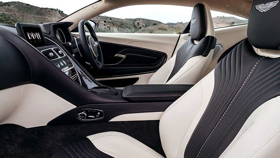 interior dashboard and seats of a Tiffany Green Aston Martin DB11