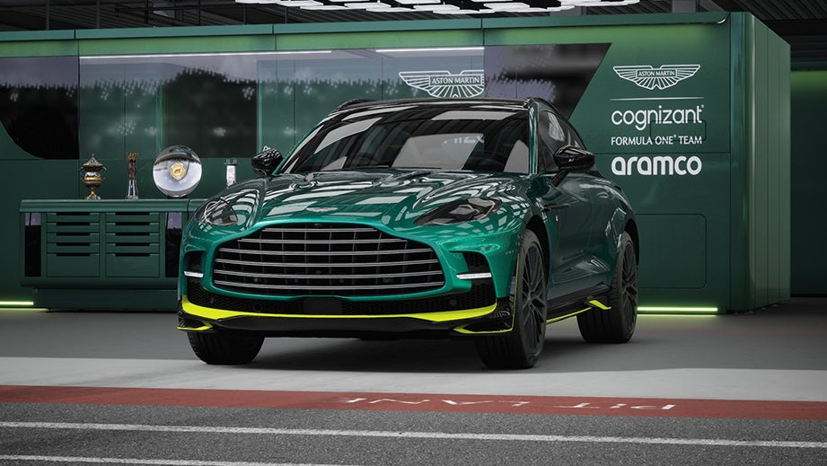 Front view of a Photon Lime Aston Martin DBX in a garage