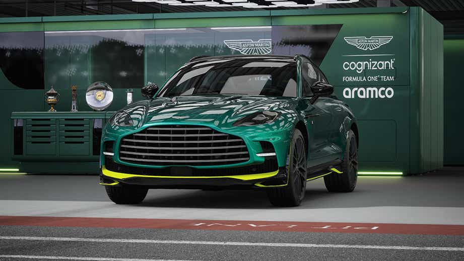 Front view of a Photon Lime Aston Martin DBX in a garage