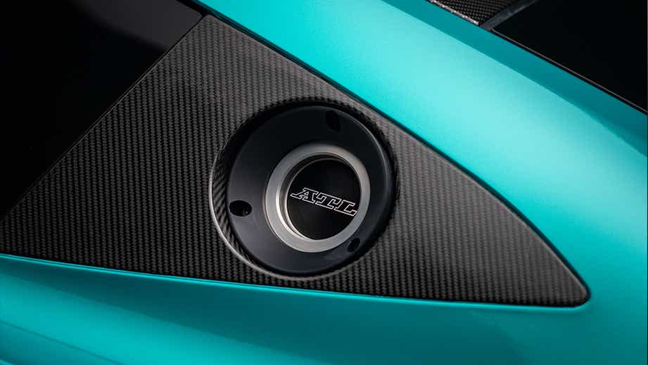 Fuel filler cap close-up of a Sunburst Yellow Aston Martin Vantage