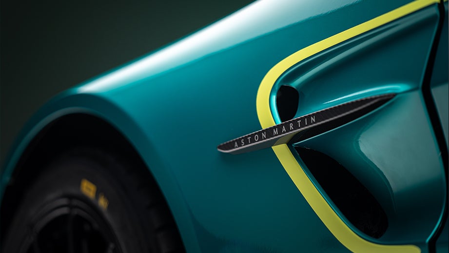 Front wheel arch and fender vent of a Sunburst Yellow Aston Martin Vantage