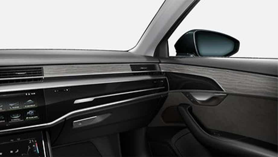 front passenger-side interior view of a Vesuvius Gray Metallic Audi A8 L