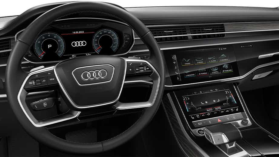 Interior dashboard and steering wheel of a Vesuvius Gray Metallic Audi A8 L