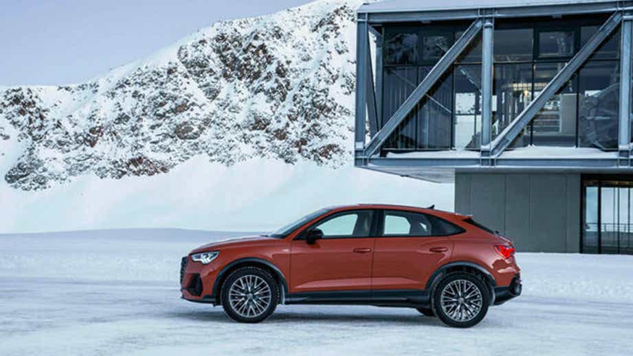 side view of an Audi Q3 Sportback in a snowy landscape