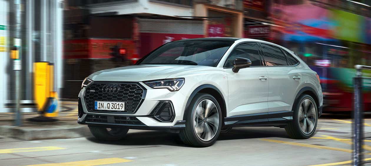 Front three-quarter view of a Audi Q3 Sportback on city street