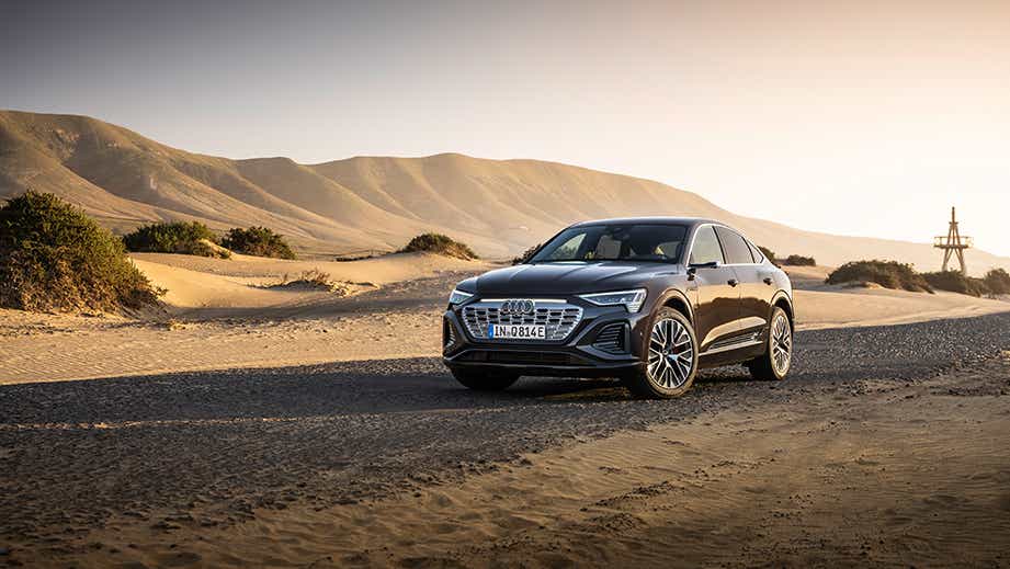front three-quarter view of a Audi Q8 Sportback e-tron on a desert road