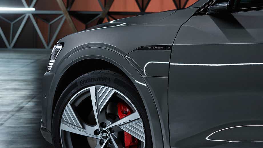 front fender and wheel of a Chronos Grey Metallic Audi Q8 e-tron