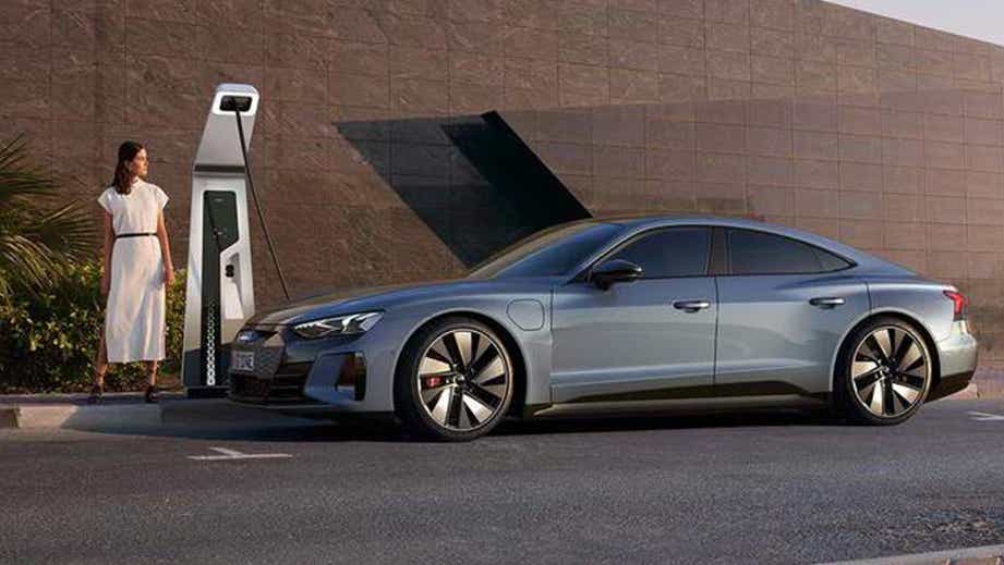 side view of an Audi RS e-tron GT at a charging station