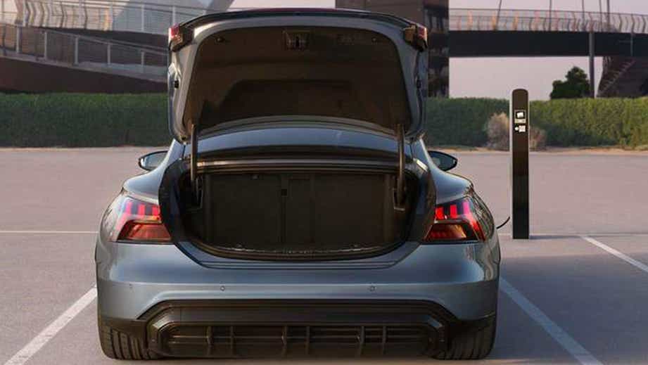 Rear view of a Mythos Black Metallic Audi RS e-tron GT with open trunk
