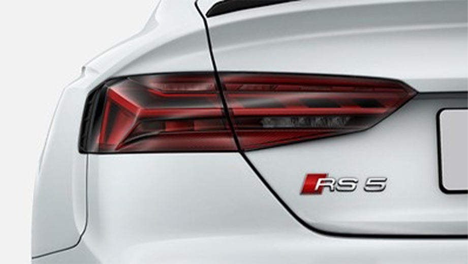 Rear tail light and badge of a Naldo Grey Audi RS5