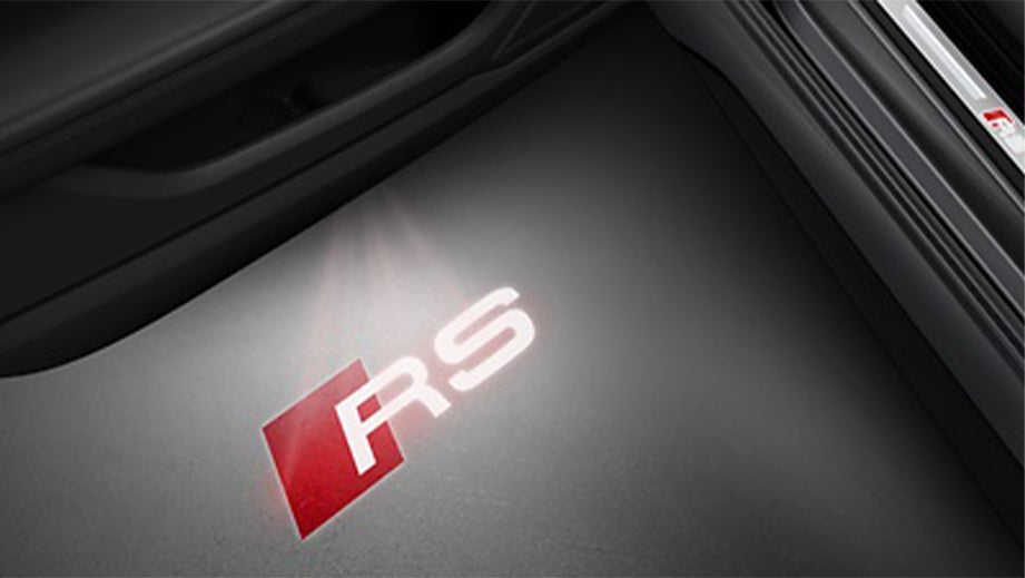 Door entry light projection of 'RS' badge in an Audi RS5