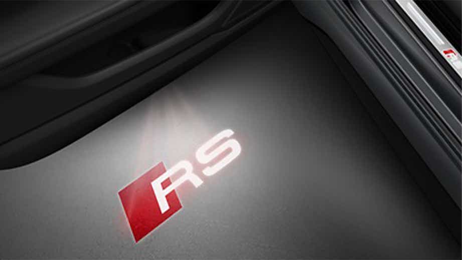 Door entry light projection of 'RS' badge in an Audi RS5