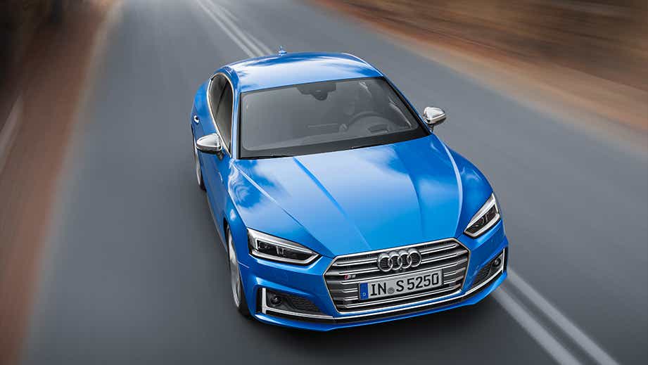 front view of a Audi S5 Sportback driving on a road