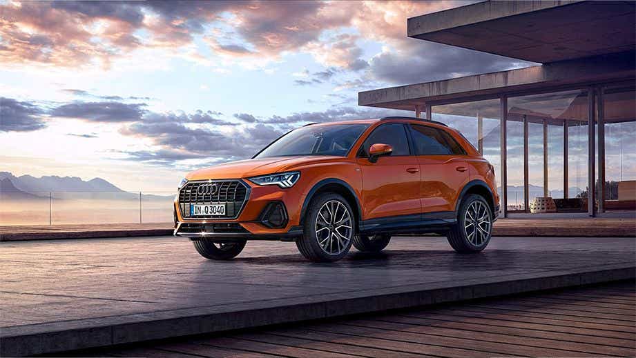 front three-quarter of a Pulse Orange Solid Audi Q3