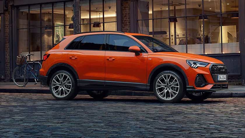 profile view of a Pulse Orange Solid Audi Q3