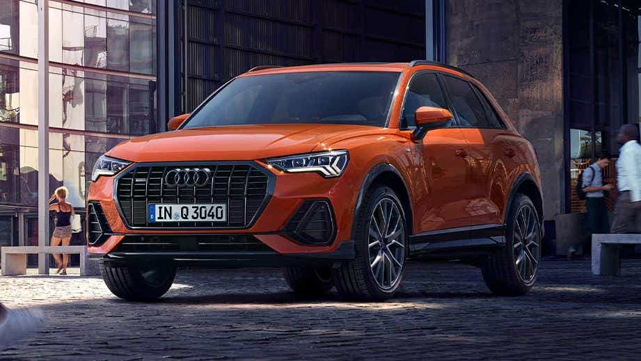 front three-quarter view of a Pulse Orange Solid Audi Q3