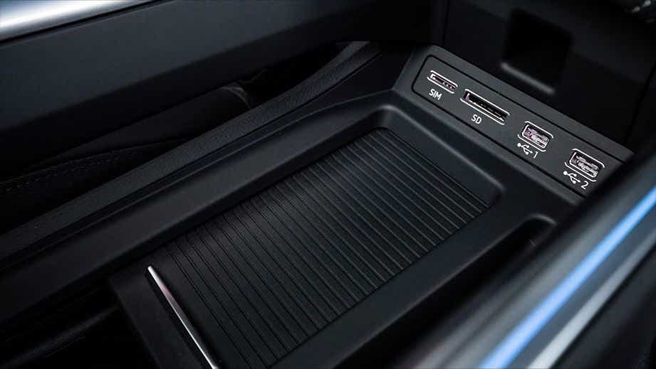 center console with SIM, SD card, and USB slots of a Audi e-tron